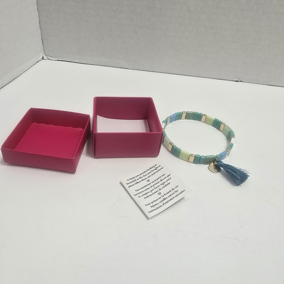 Avon Jewelry - Avon Blue and Cream Beaded Bracelet with Tassel